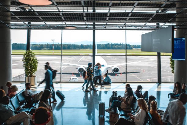 istock Diverse People Casually Waiting At Departures Terminal 1573789678