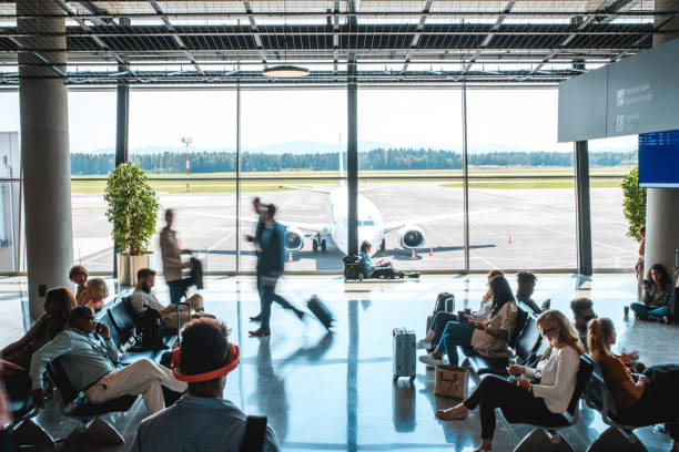 istock Diverse People Casually Waiting At Departures Terminal 1573790191