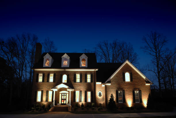 istock A luxurious large manor home lit up at night 157379113
