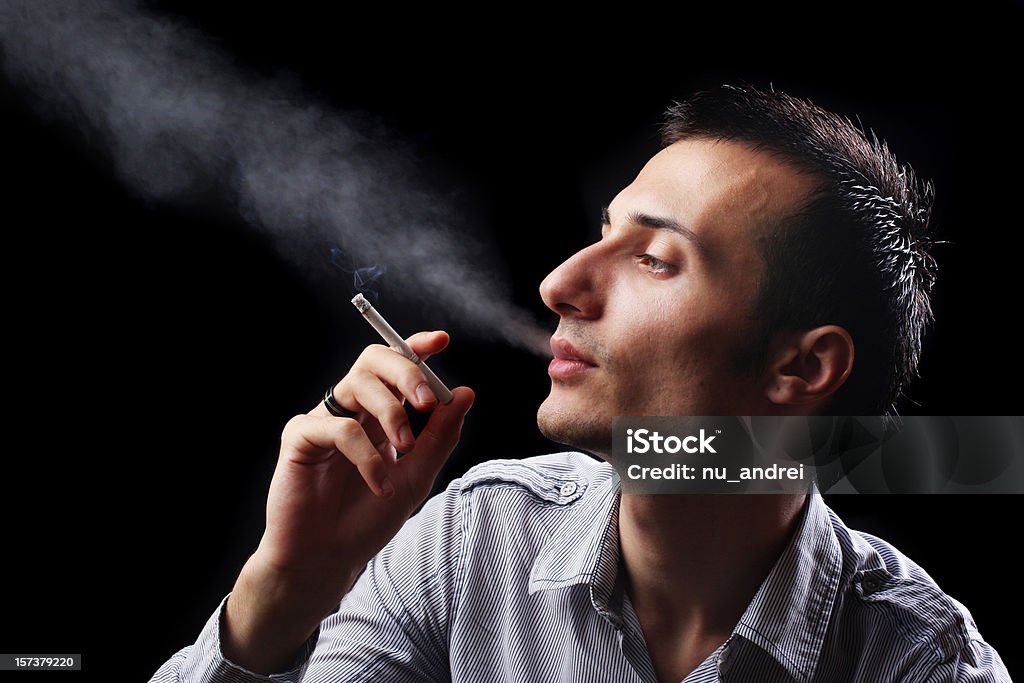 Smoking young man having a smoke Addiction Stock Photo