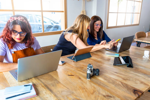 istock Young Women Collaborating in Modern Office Spaces 1573794464