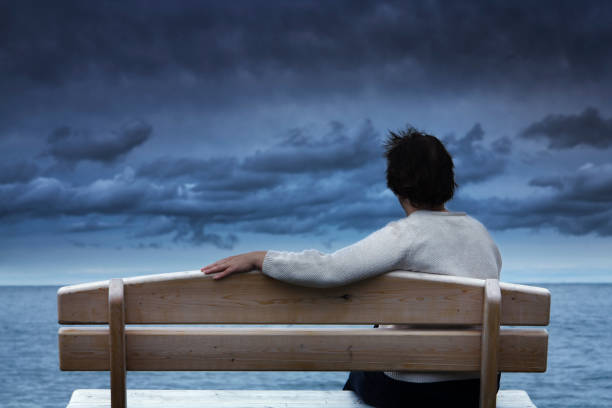 istock Loneliness, Grief, Sadness, or Depression Expressed by Woman Waiting Alone 157379689
