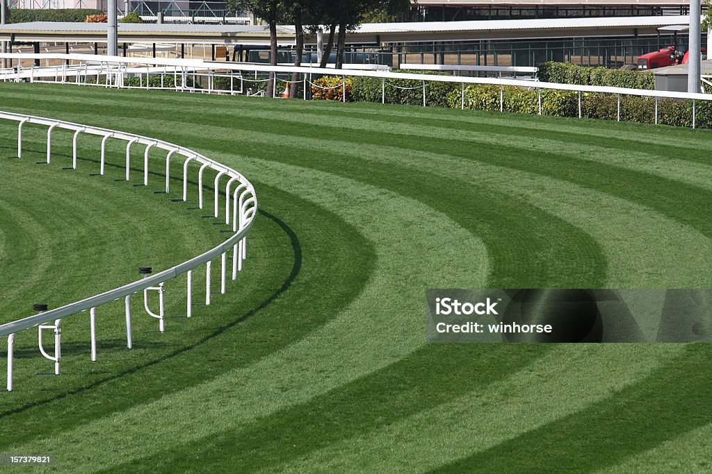 Mowed lawn used as a horse racing track restricted by fence Turf track in Racecourse. Horse Racing Stock Photo