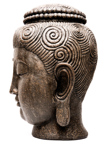 Side view of generic Buddha's head on white background. Taken with Canon Eos 1DS Mark III in studio.