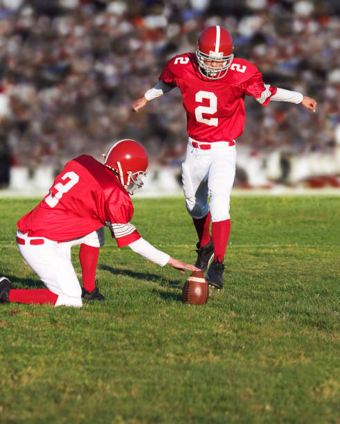 istock Football Player Kicking Field Goal 157380206