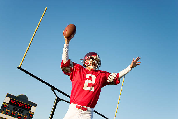 istock A football player in a red jersey after a touchdown 157380327
