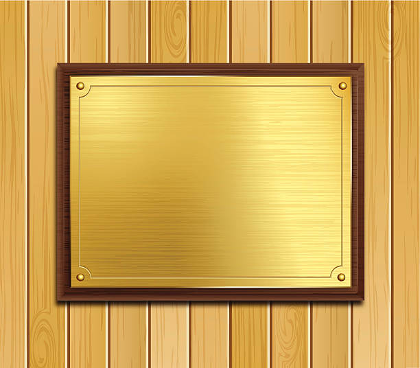 plakette aus messing auf holz-hintergrund - brass stock-grafiken, -clipart, -cartoons und -symbole