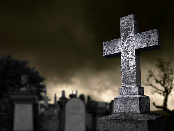 жуткий graveyard - old cross shape stone weathered стоковые фото и изображения
