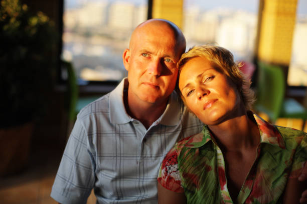 Attractive Happy mature couple in sunset light