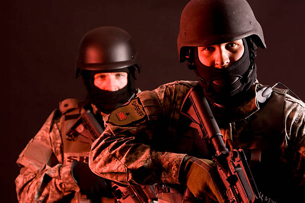 Two members of a SWAT team with weapons stock photo