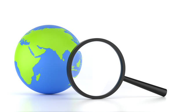 Global trends, world wide customer insights, digital online connection technology and business marketing, web browser concept. Close-up digital globe inside magnifying glass len on brown background.