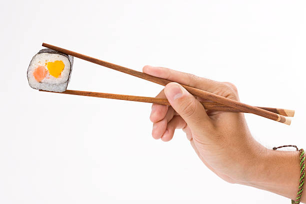 寿司ロールと箸 - 巻き寿司 ストックフォトと画像