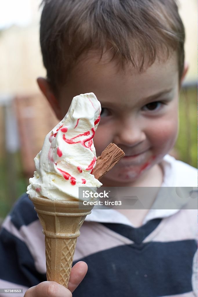 Three year old with ice-cream focus on cornet Three year old with ice-cream 2-3 Years Stock Photo