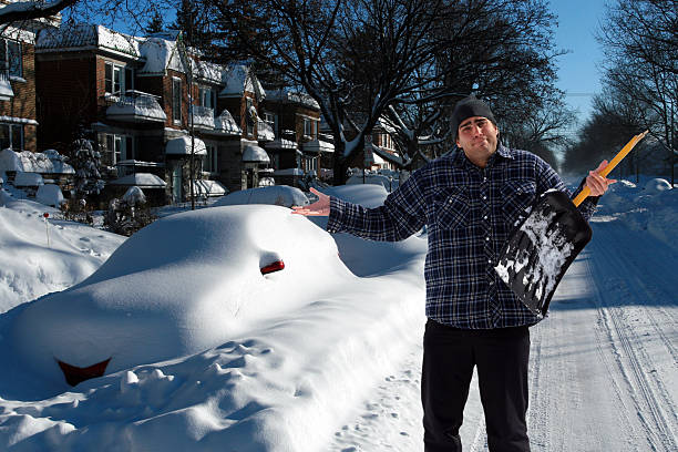 Desperate Man with Broken Shovel After a Big Snowstorm