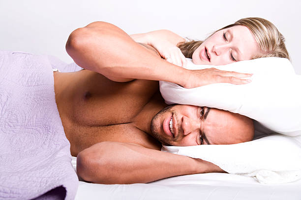 jede nacht! die schnarchen! - couple love snoring sleeping stock-fotos und bilder