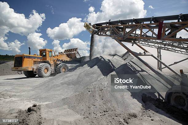 Functioning Industrial Quarry With Trucks At Work Stock Photo - Download Image Now - Conveyor Belt, Quarry, Bulldozer