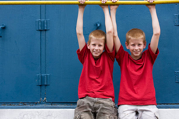 twins hanging around stock photo