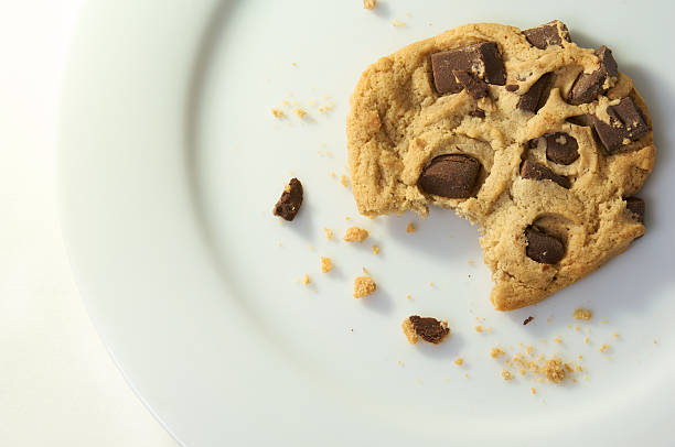 チョコレートチップクッキー、お食事をされています - cookie missing bite crumb eaten ストックフォトと画像