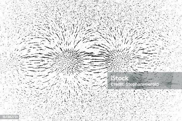 Demonstrating Magnetic Field Lines Of Attracting Poles Using Iron Filings Stock Photo - Download Image Now