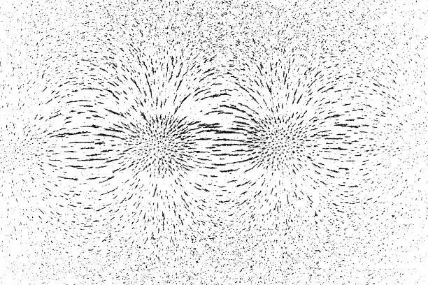 This is a demonstration of magnetic field lines where two bar magnets were placed beneath a piece of paper and iron filing was scattered on the top side. This particular photo shows what the field lines look like for two attracting poles.