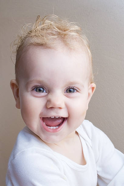 Cheerful baby girl stock photo