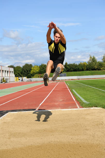 Long jump action  long jump stock pictures, royalty-free photos & images