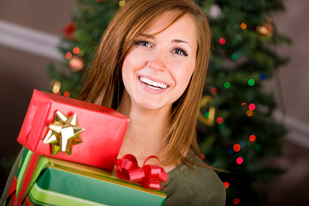 istock Young Woman with Christmas Present 157382957
