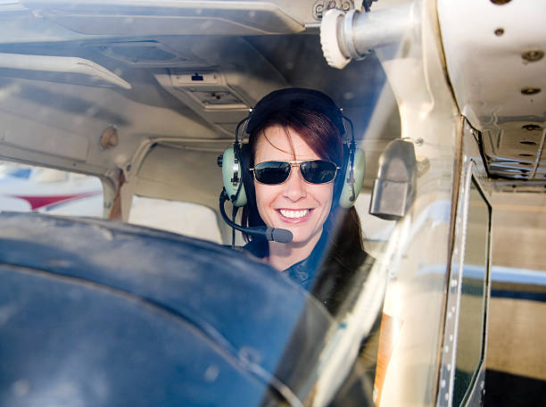istock Woman Pilot in an Airplane 157383703