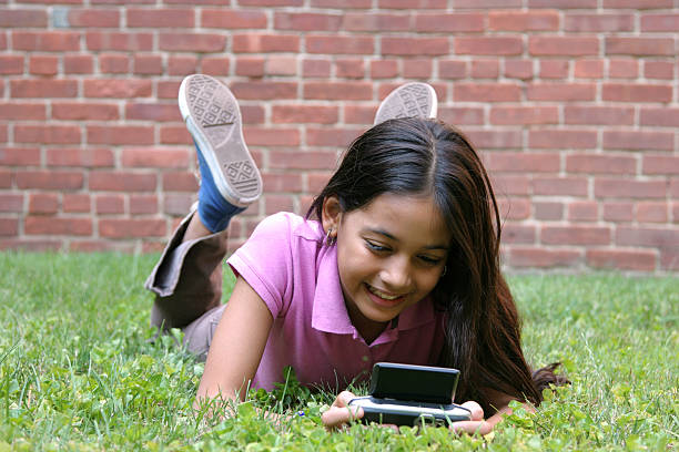 Hispanic Girl Text Messaging stock photo