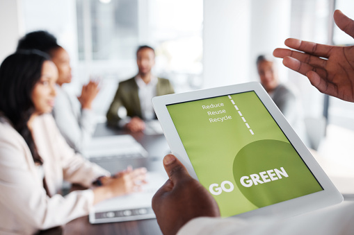 Go green, business meeting and people on tablet screen for sustainable project, eco friendly investment and growth. Vegan presentation, sustainability and man speaker or presenter speaking to clients