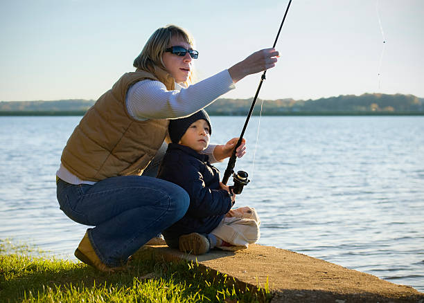 istock Mother and son fishing 157384297