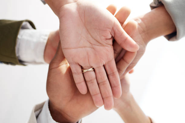 istock Teamwork, closeup and hands stacked of support, target or team building mission in circle or group motivation below. Business people, together hand sign in community goals or professional cooperation 1573848444