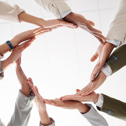 Circle, teamwork and synergy hands of people collaboration, workflow and group or team building from below. Integration, formation and support, cooperation or community of women and men in agreement