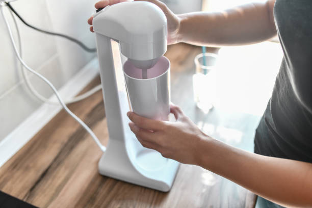 istock Female Using Mixer To Prepare Ice Coffee Foam 1573860105