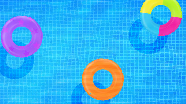 istock Swim rings on swimming pool water background. Inflatable rubber toy. Realistic summertime illustration. Summer vacation or trip safety item. Top view swimming circles. 1573860660