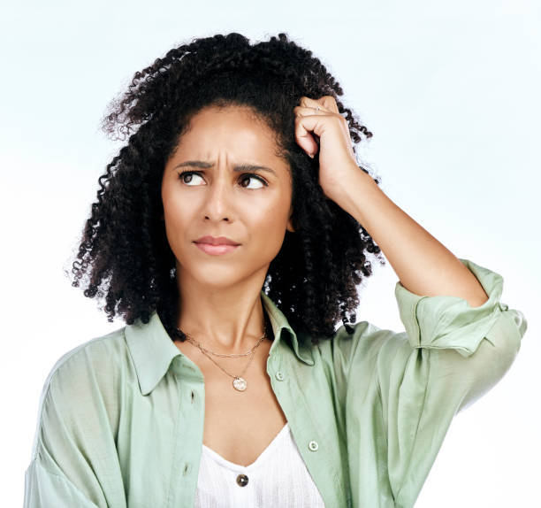 istock Woman, frustrated thinking and confused in studio with ideas, mistake and fail by white background. African girl, model or student with stress, doubt or memory with mindset, decision and questions 1573875056