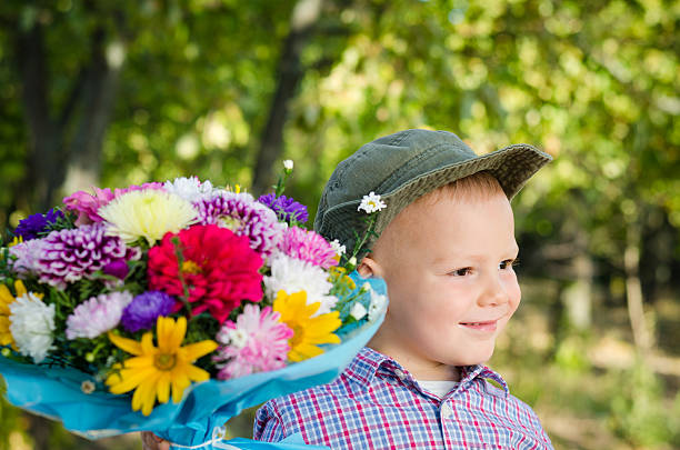 istock Little boy with flowers for a loved one 157389362