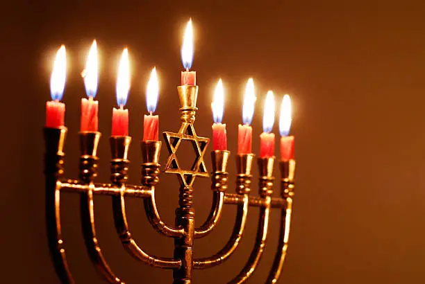 Candles lit for the eighth night of Hanukkah