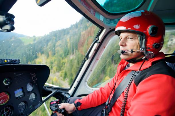 istock Male Pilot Flying Helicopter 157389594