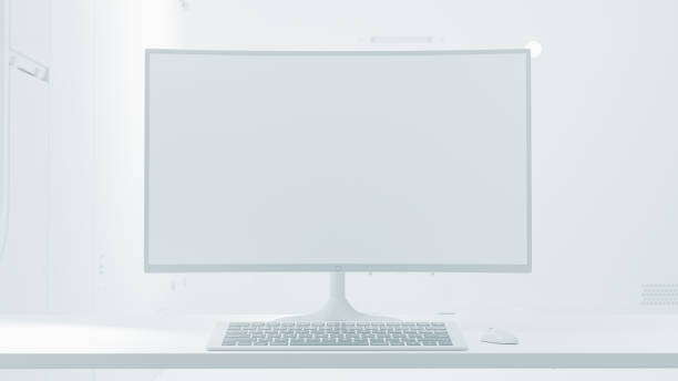 istock Computer Mock-Up white color on work desk in laboratory white room. Designed in minimal concept. Can be used in education or business background. 1573897401