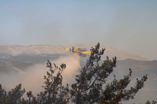RHODES, GREECE - JULY 23-27: Wild fires are burning the center and south of the island, turists were evacuated to safety, fire fighters aand volunteers are fighting day and night to control the situation. (photo by LEFTERIS DAMIANIDIS)