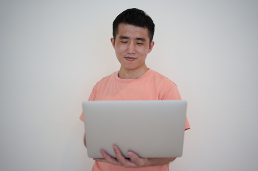 Young men using laptops