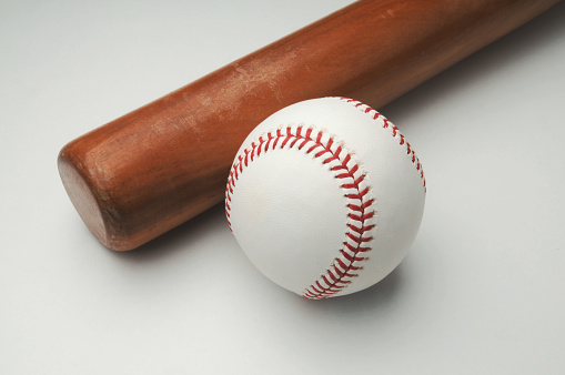 Baseball and bat on white background