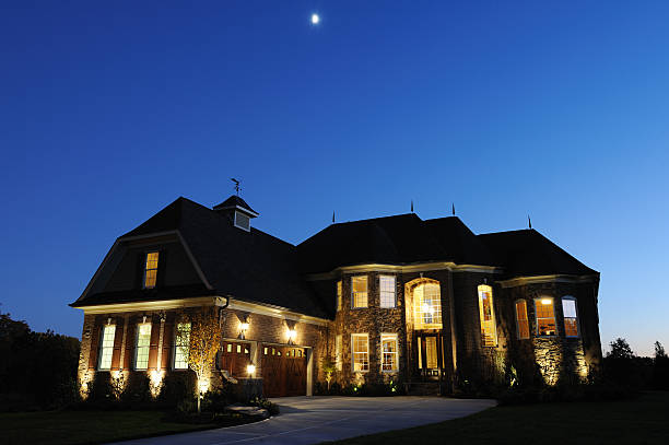 istock Mansion exterior with the lights on at night 157393169