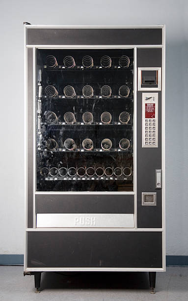 Vending Machine An empty vending machine. The glass front is smudged and grungy. vending machine stock pictures, royalty-free photos & images