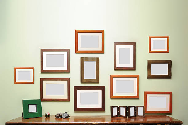 lots of frames on the wall  hanging photos stock pictures, royalty-free photos & images