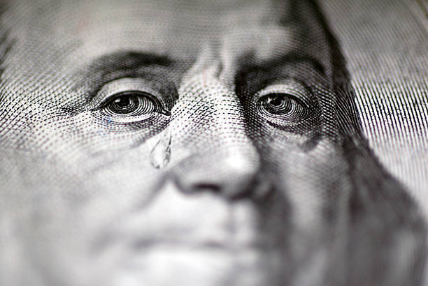 Tear falling from face on US dollar bill, close-up  financial crises stock pictures, royalty-free photos & images