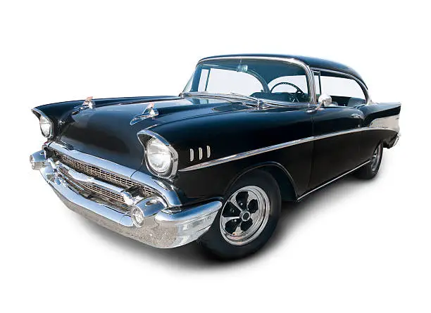 A Black 1957 Chevrolet shot at a wide angle. Vehicle has outline path that excludes shadow, or use as is on white.