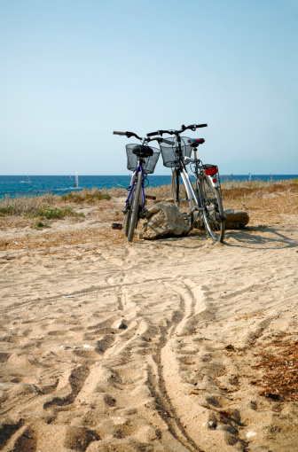 Two bicycles parked near the shore (island of Levkas, Greece), waiting for their owners to come back.