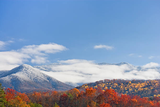 Autumn day with snowfall on the mountains stock photo